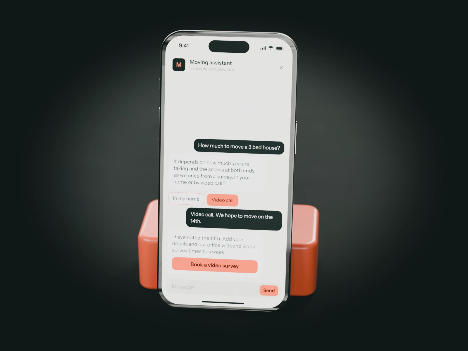 A phone on a coral stand showing an example chat with a removal company's moving assistant: a family leaving a three-bedroom house asks for a price and books a video survey.