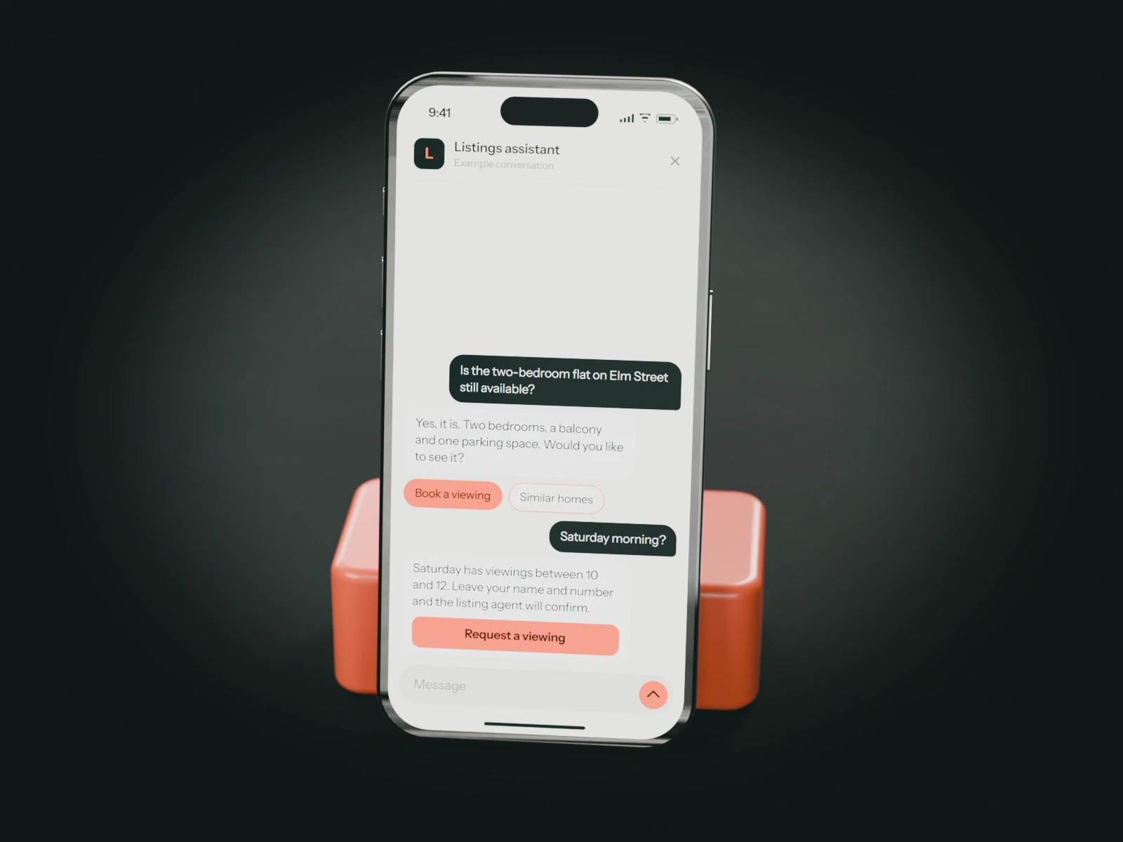 A phone on a coral stand showing an example chat with an estate agency's listings assistant: a buyer asks about a flat and requests a Saturday viewing.