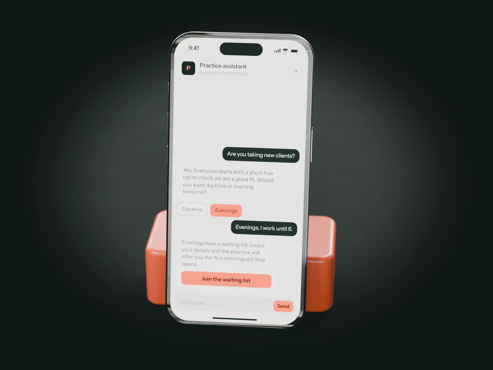 A phone on a coral stand showing an example chat with a counselling practice's assistant: someone looking for evening sessions joins the waiting list.