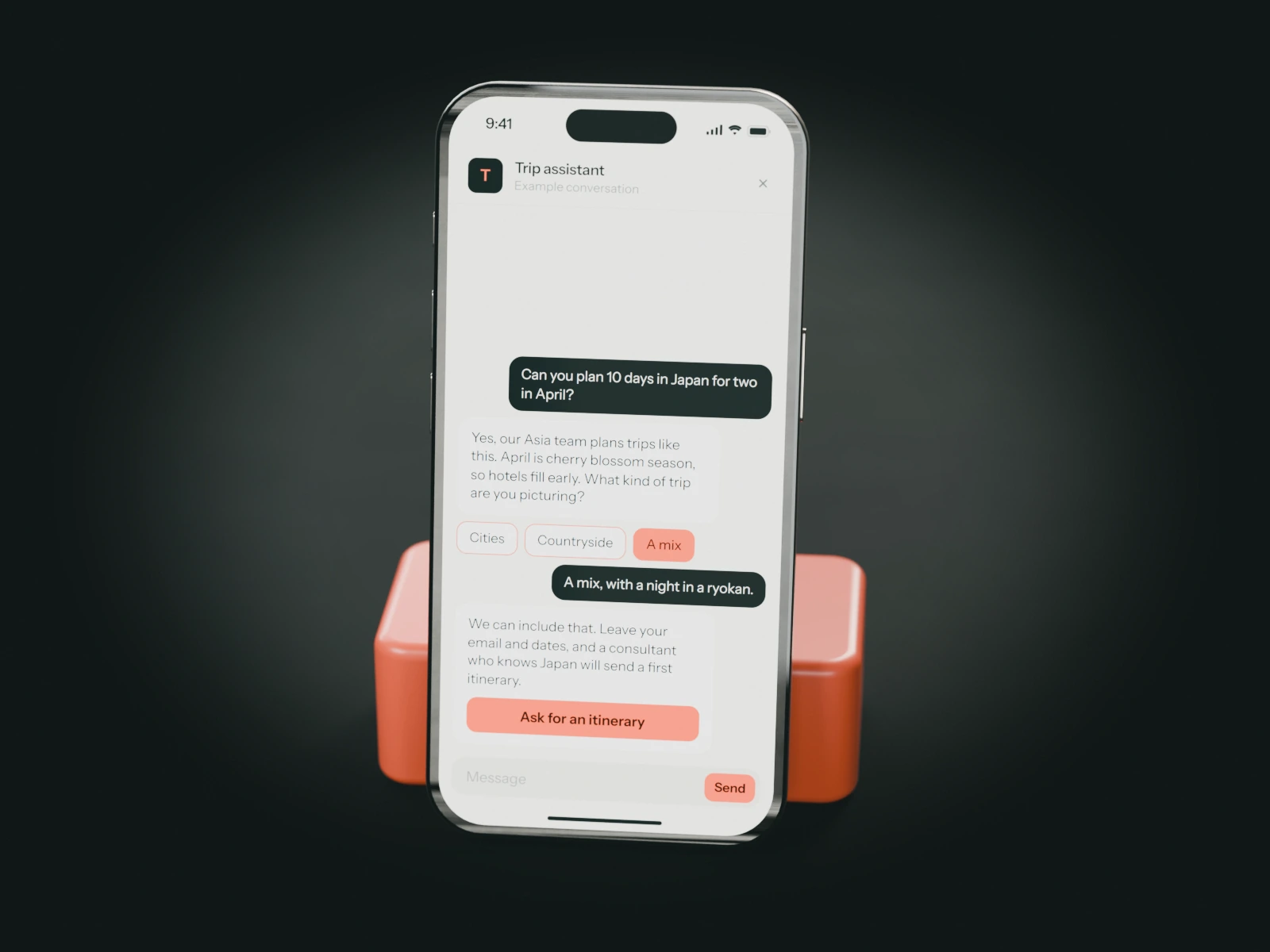 A phone on a coral stand showing an example chat with a travel agency's trip assistant: a couple asks for ten days in Japan in April and is offered a first itinerary from a consultant.